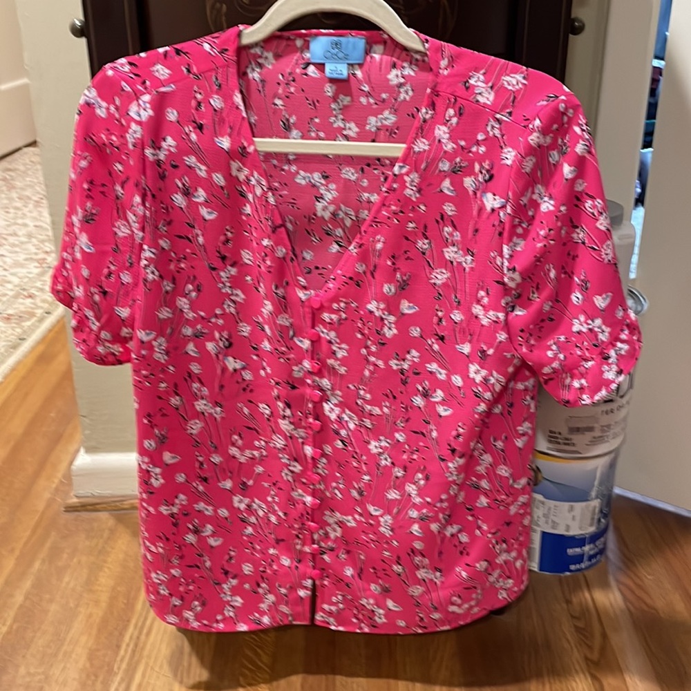 Vibrant CeCe button up blouse with black, white & blue floral design.